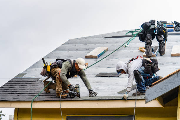 Professional Roofing technician working in State Farm, VA